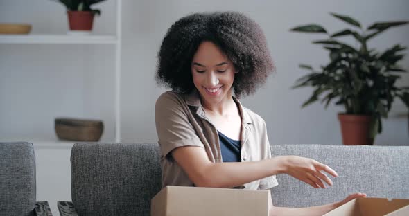 Attractive Cartoon Girl Receives Gift in Mail, Box with a Surprise, Interested Lady Opens Cardboard alt