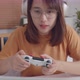 Young asian women play video game relaxing in free time sits at home - VideoHive Item for Sale