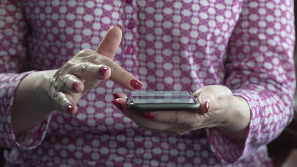 woman hands slide fingers on cell phone