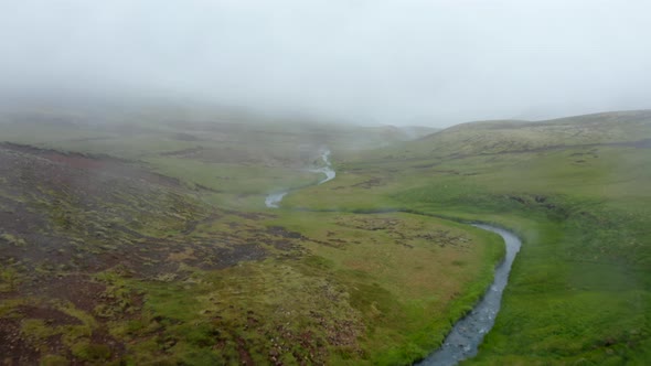 Birds Eye View of Reykjadalur Hot Spring River Pools Valley in Foggy Day alt