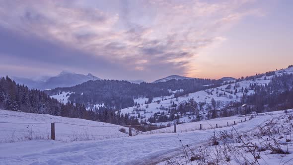 Sunset  winter snow landscape. The sky is colored red alt