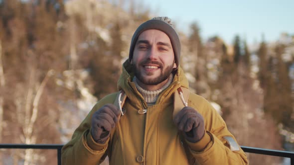 Portrait Of Smiling Male Tourist alt