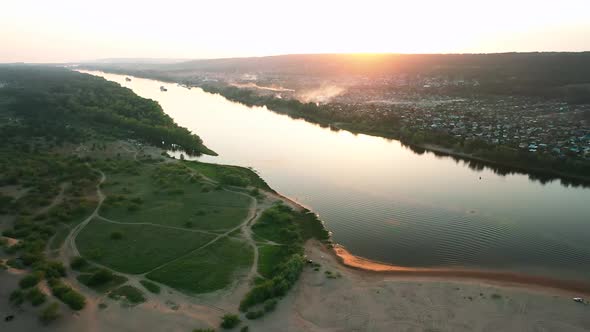 Aerial View, River Flows Between Two Banks, Sand Spit. Beautiful Nature Landscape, River Flood