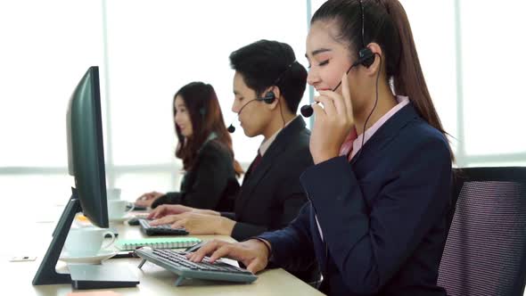 Business People Wearing Headset Working in Office alt