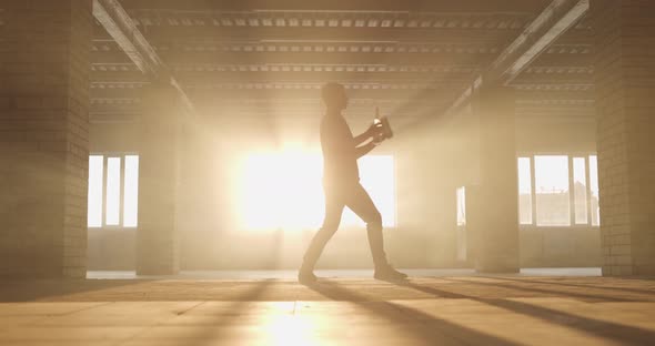 Wide Angle View of Professional Bartender Juggles Bottles alt