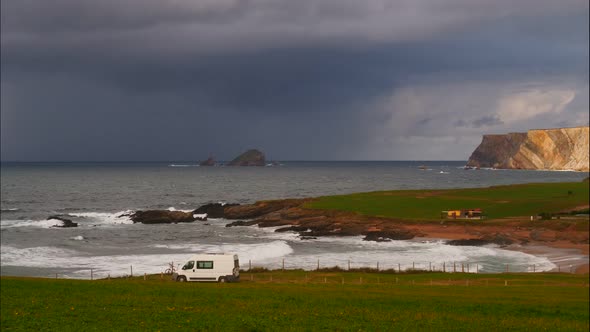 Clouds over Verdicio Beach, Asturias Coast, Spain. Timelapse alt