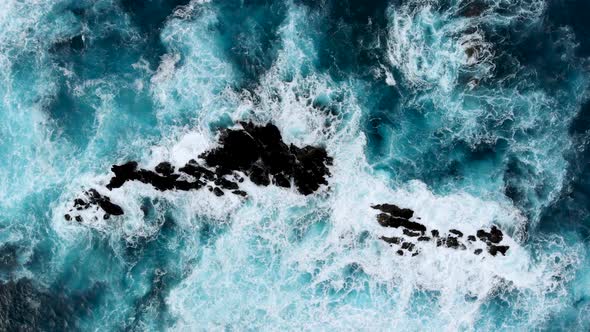 Drone Hovering Above Big Waves Crashing Into Cliffs Near the Shores of Madeira Island Portugal