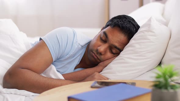 Man Looking at Smartphone and Goes Back To Sleep alt