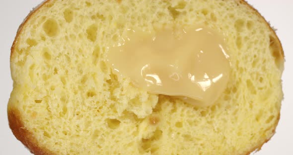 Donut With Condensed Milk Sprinkled With Powdered Sugar alt