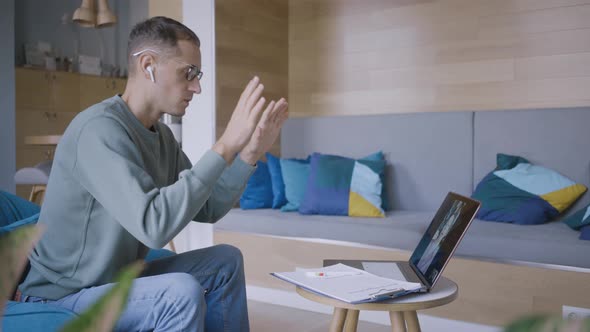 Psychologist Shows Breathing Exercises to Client Via Laptop