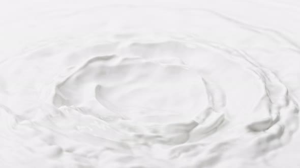 Super Slow Motion Shot of Waving Fresh Milk at 1000 Fps alt