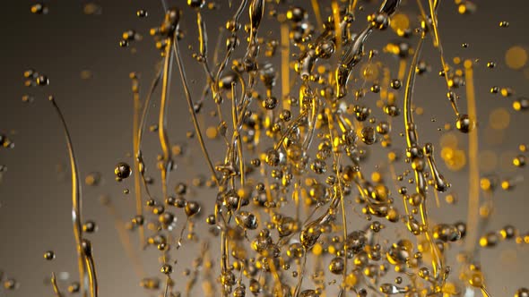 Super Slow Motion Shot of Splashing Oil on Gradient Background at 1000Fps alt