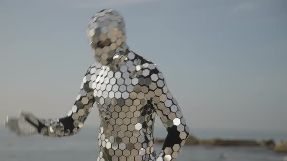 Sparkling Discosuit Man Dancing Next to the Sea alt