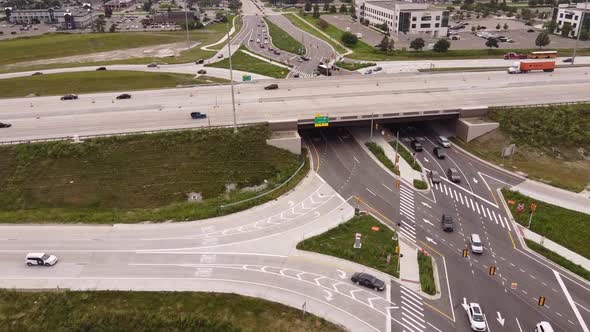 Driving Through Diverging Diamond in Michigan, USA  In The Afternoon - aerial shot alt
