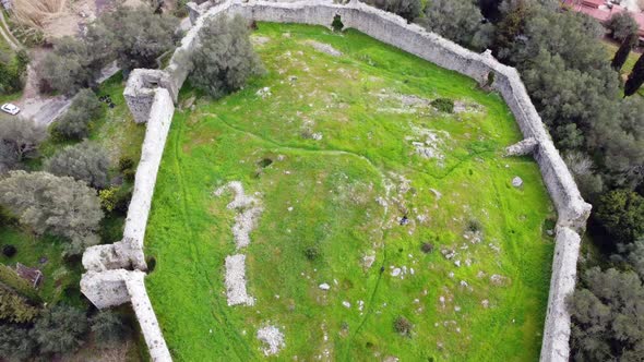 Stunning aerial view flight bird's eye view drone footage of castle ruins of a byzantine fortress o alt
