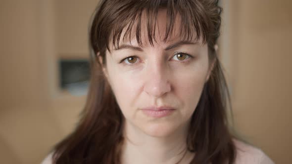 Portrait of a Housewives Looking at the Camera and Smiling Close Up Moving Camera