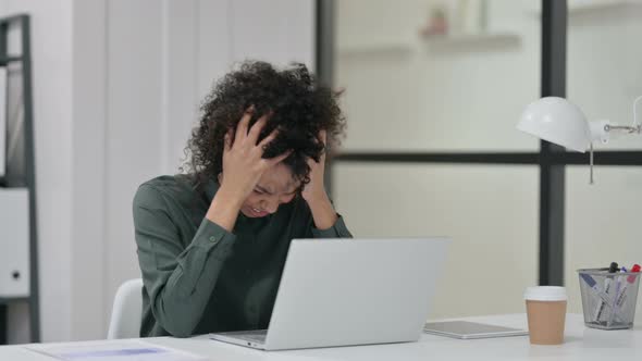 African Woman Feeling Disappointed While Using Laptop alt