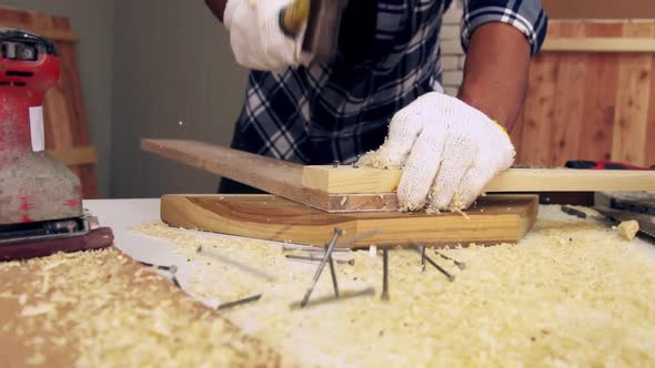 Carpenter Working on Wood Craft at Workshop alt