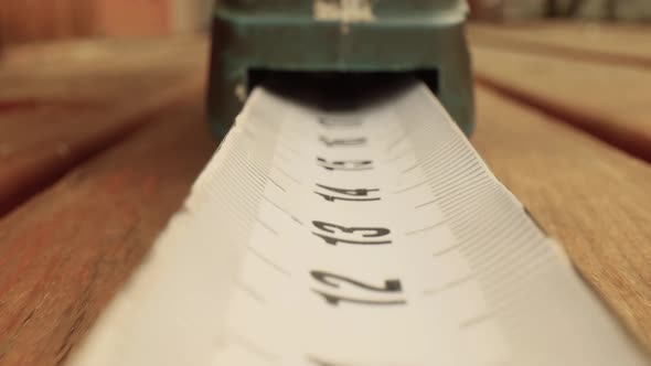 Roll of Measuring Tape in Motion Macro alt