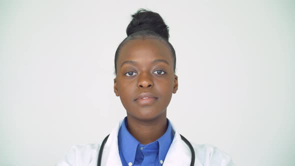 Confident Smiling African Female Doctor Looking at Camera Head Shot Portrait alt