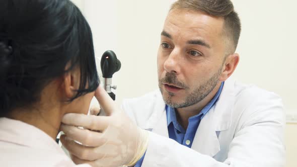 The Doctor Carefully Studies the Patients Eye with the Help of the Device