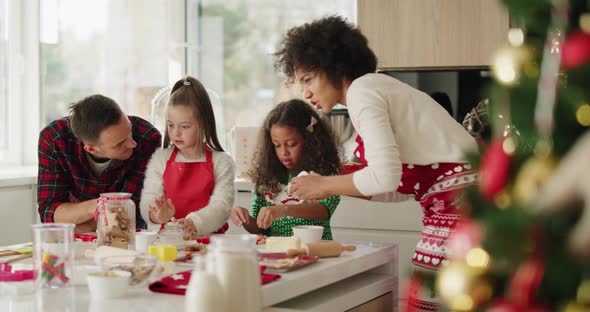 Family making yummy cookies for Christmas alt