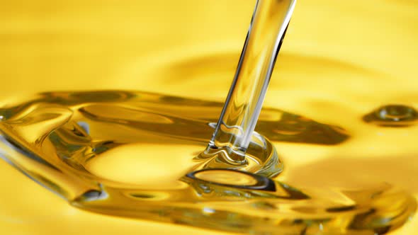 Super Slow Motion Shot of Pouring Oil Liquid at 1000Fps. alt