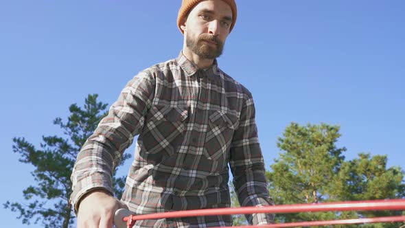 Bearded man volunteering outdoors