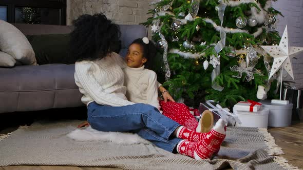 Portrait of African American Mom and Her Little Daughter Hugging and Talking Cute alt