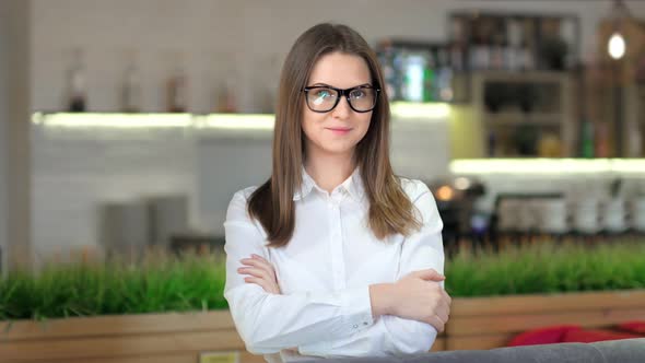 Portrait of Smiling European Businesswoman Wearing Glasses and White Classic Shirt alt