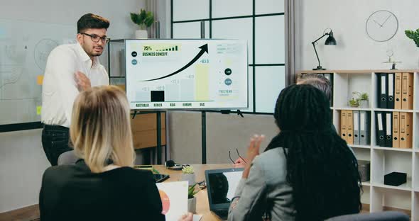 Bussinessman Explaining Presentation on Whiteboard alt