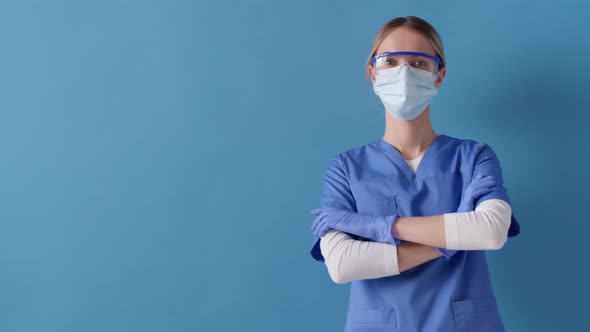 Nurse standing with her arms crossed at work. Concept of safety life