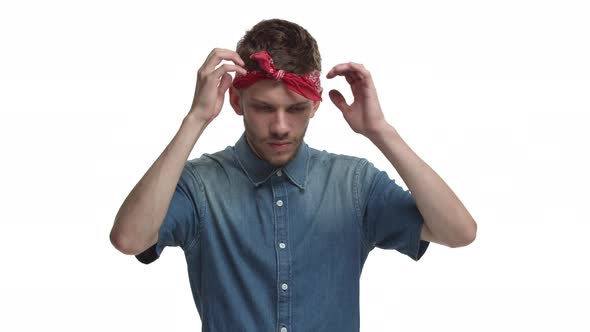 Young Annoyed Male Hipster with Red Headband Over Forehead Showing Head Explosion Gesture and