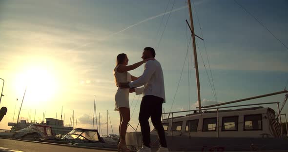 A Man and a Woman Converge on the Pier alt