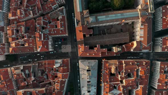 Top down drone shot over red rooftops European City at sunset Lyon France alt