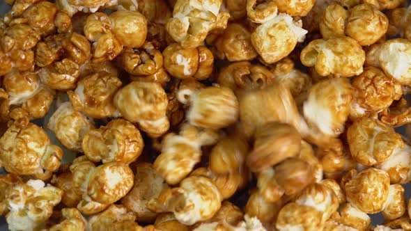 Coffee taste popcorn falls close up. Caramel popcorn. Healthy food for morning breakfast. Healthy alt