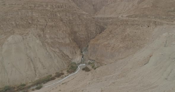 Aerial view of a waterfall in a desert, Israel. alt