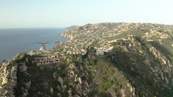 famous Italian city on mountains of Sardinia island, aerial pan shot alt