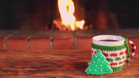 Christmas Cup of Mulled Wine Near Fireplace Winter Holiday Xmas and New Year Concept alt