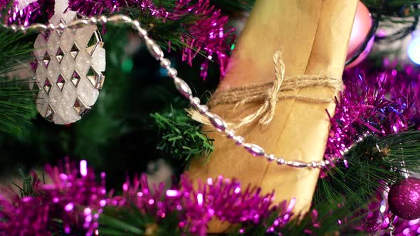 New Year's gift wrapped in paper tied with a thread among alt