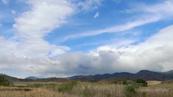 Mountains in the Background of Gray Clouds Dark Clouds Envelop the Tops of the Mountains alt