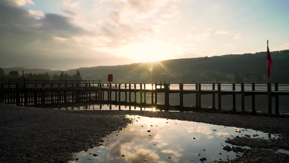 Sunrise Over a Lake Shoreline