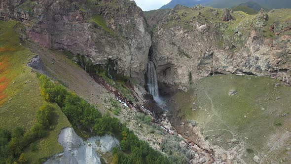 Waterfall Falling From Mountain Crack in Elrbus Region