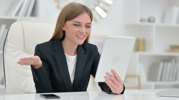 Professional Businesswoman Doing Video Call on Tablet  alt