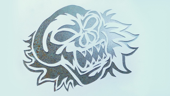 Skull Artwork Is Sprayed Onto Metal alt