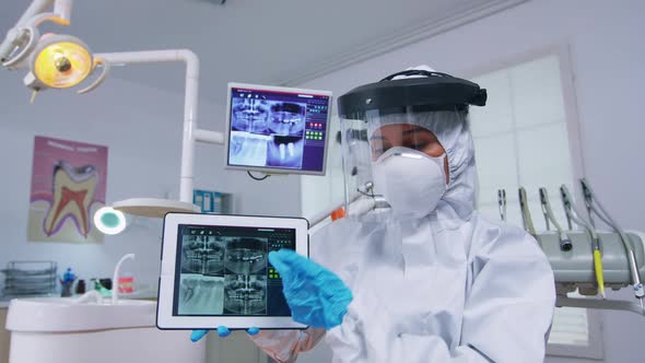 Patient Pov of Dentist Explaining Dental Digital Radiography alt
