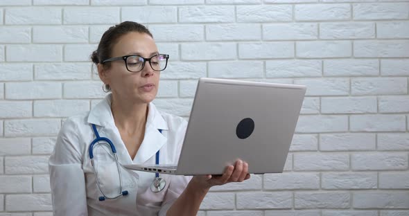 Woman Doctor with Webcam alt