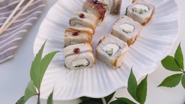 Various Types of Sushi Are Beautifully Served in a Rustic Style alt