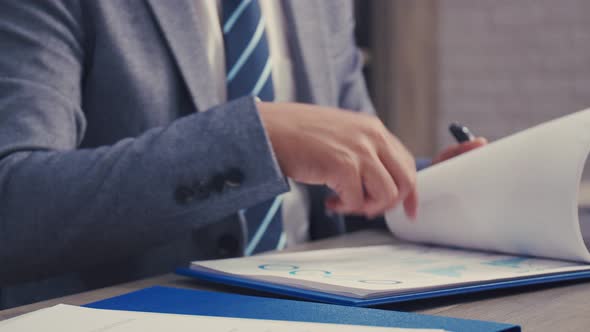 Close up hands of Asian business working at the office.