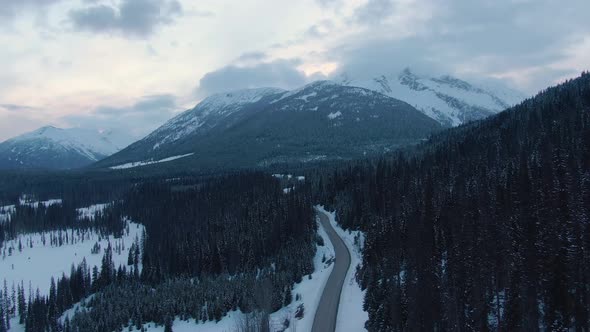 Aerial View of a Scenic Road in the Canadian Mountain Landscape alt